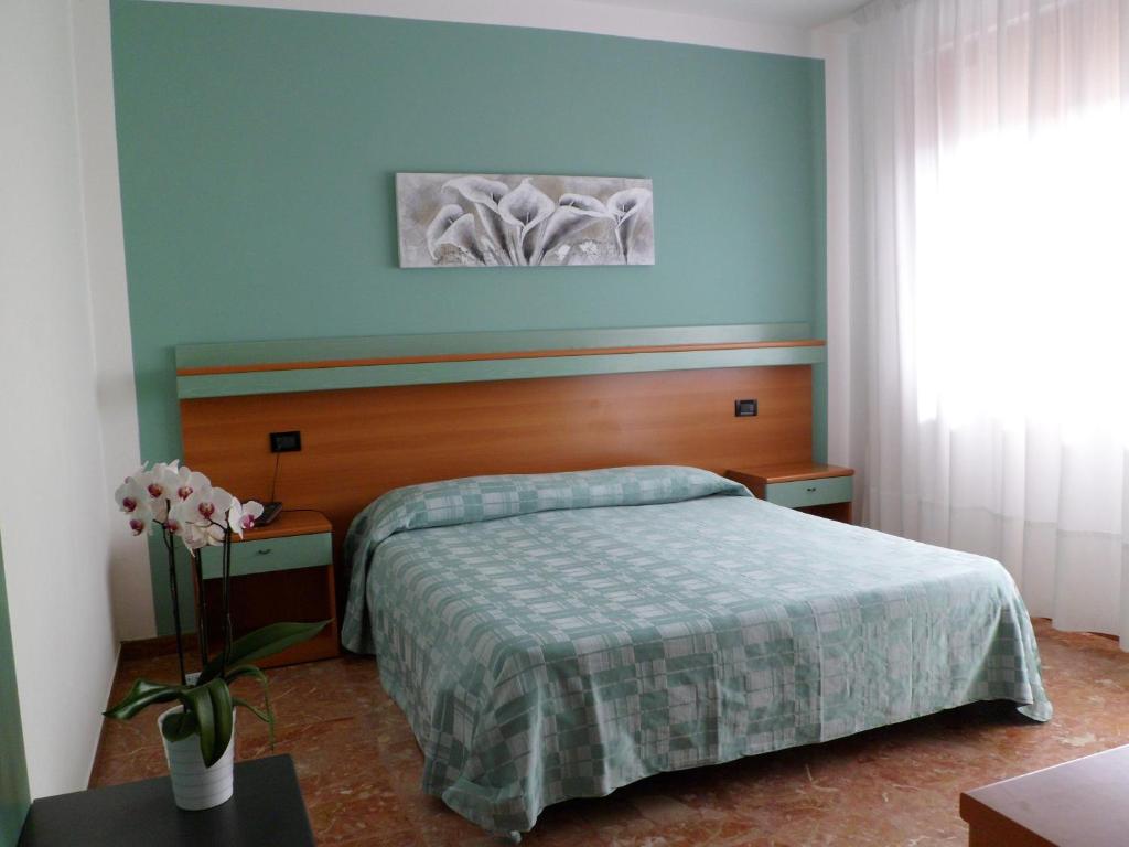 Postel nebo postele na pokoji v ubytování Hotel Europeo