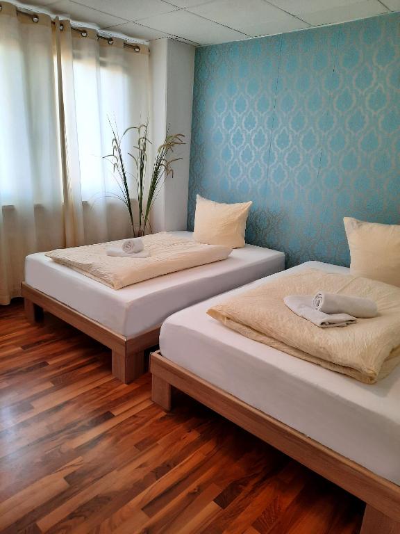 Postel nebo postele na pokoji v ubytování Easy Stay Rooms