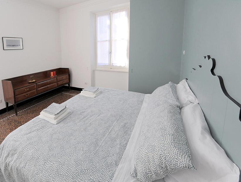 A bed or beds in a room at La Casa della Fiore