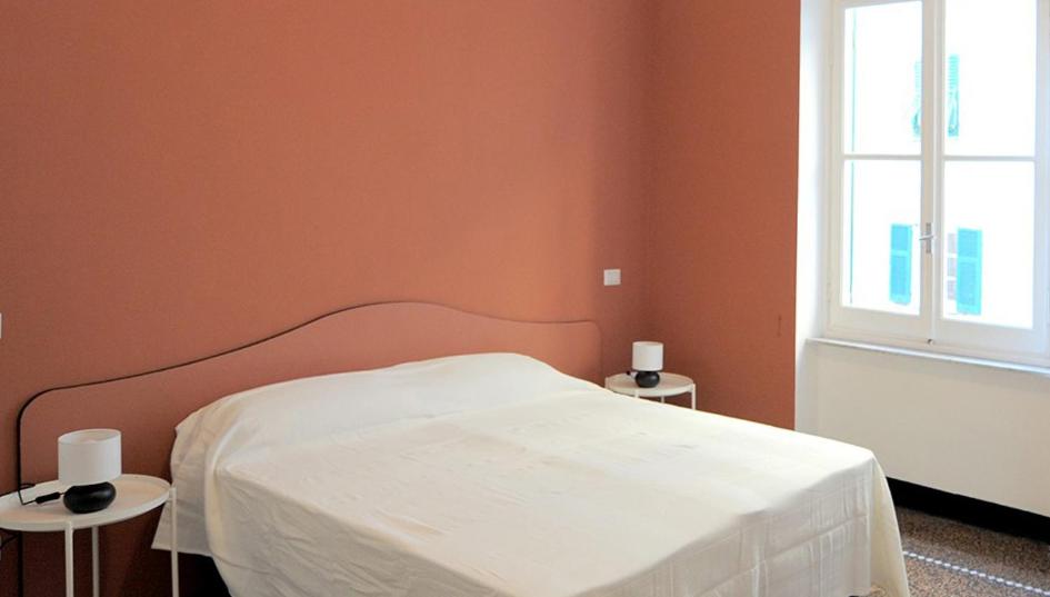 A bed or beds in a room at La Casa della Fiore