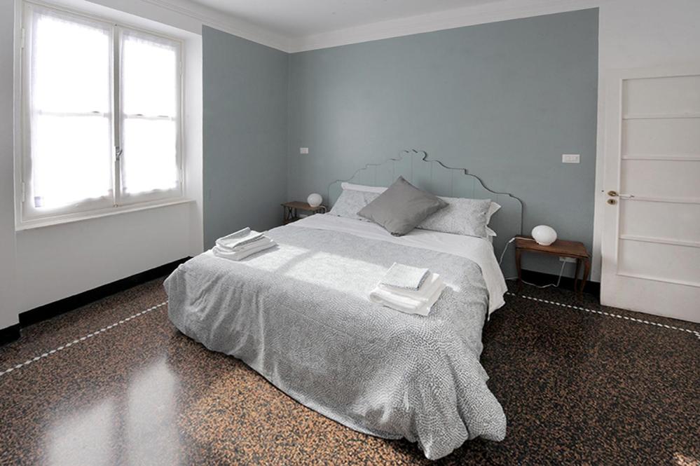 A bed or beds in a room at La Casa della Fiore