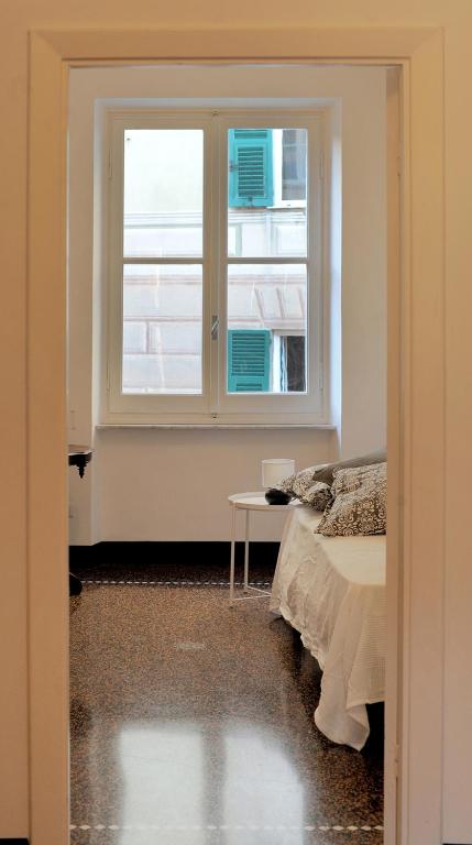 A bed or beds in a room at La Casa della Fiore