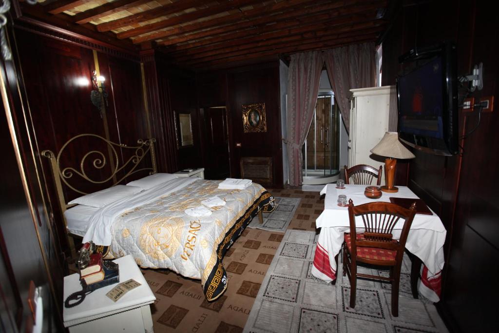 Postel nebo postele na pokoji v ubytování Hotel Iliada
