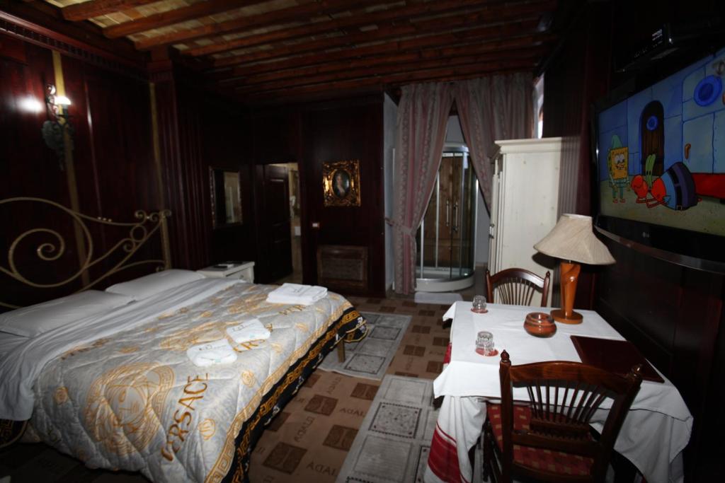 Postel nebo postele na pokoji v ubytování Hotel Iliada