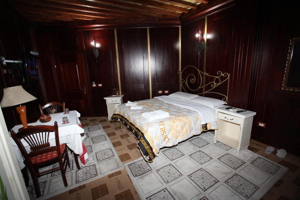 Postel nebo postele na pokoji v ubytování Hotel Iliada