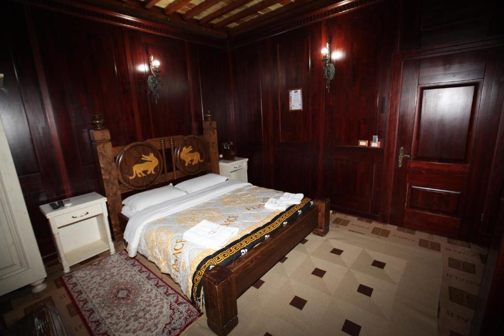 Postel nebo postele na pokoji v ubytování Hotel Iliada
