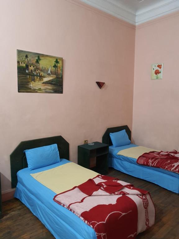 Postel nebo postele na pokoji v ubytování African House Hostel