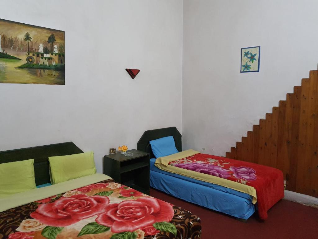 Postel nebo postele na pokoji v ubytování African House Hostel