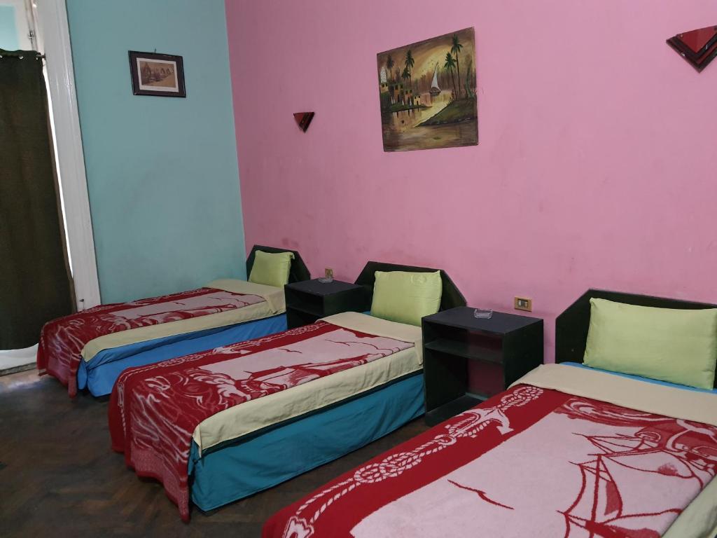 Postel nebo postele na pokoji v ubytování African House Hostel