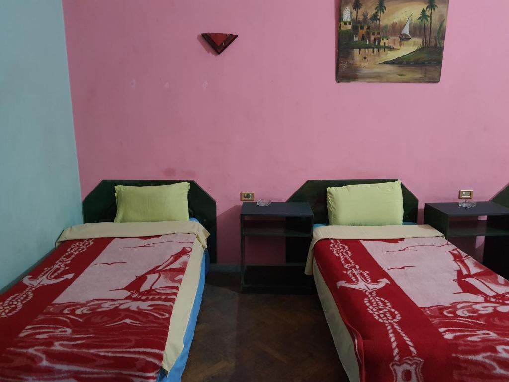 Postel nebo postele na pokoji v ubytování African House Hostel