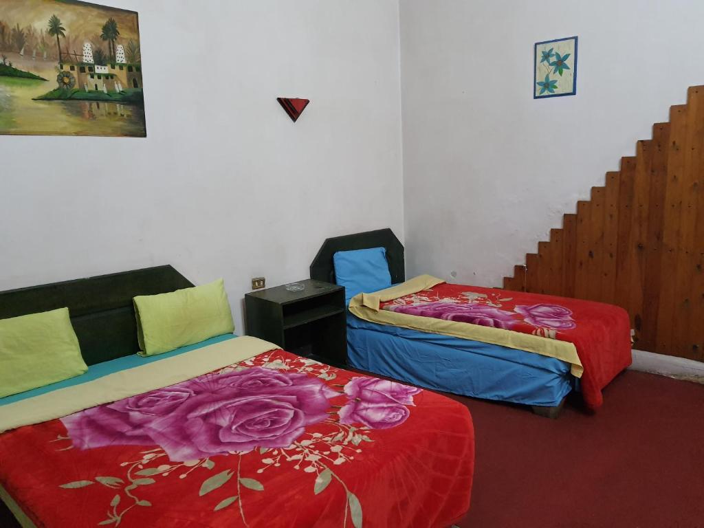 Postel nebo postele na pokoji v ubytování African House Hostel