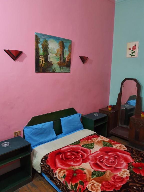 Postel nebo postele na pokoji v ubytování African House Hostel