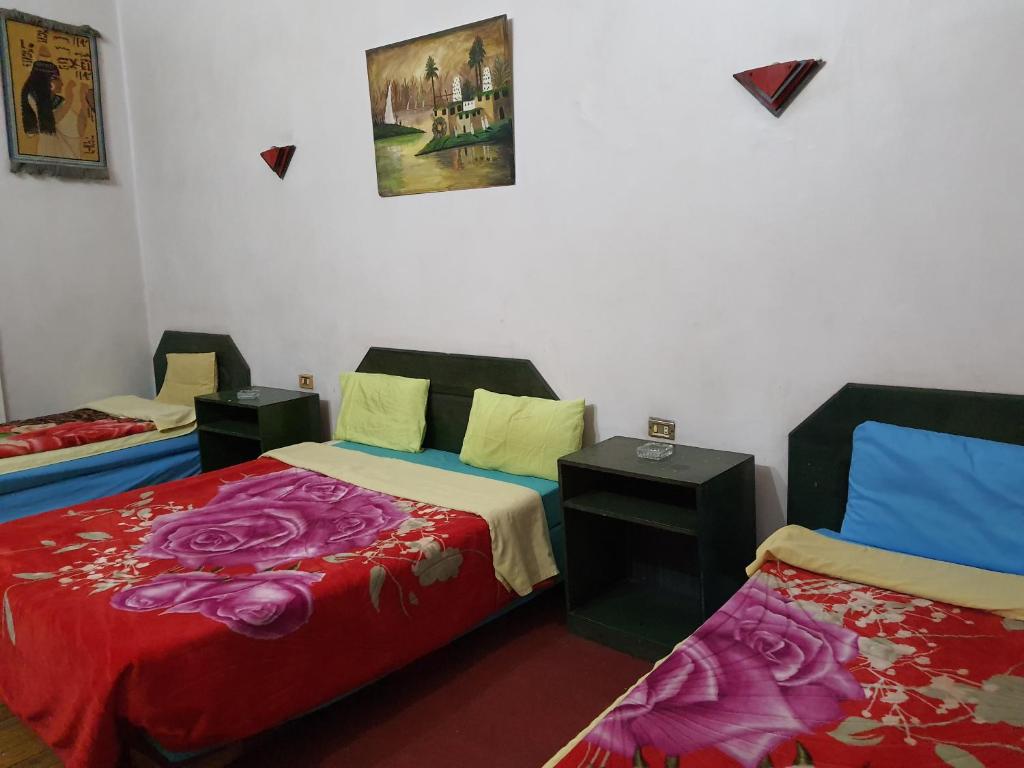 Postel nebo postele na pokoji v ubytování African House Hostel
