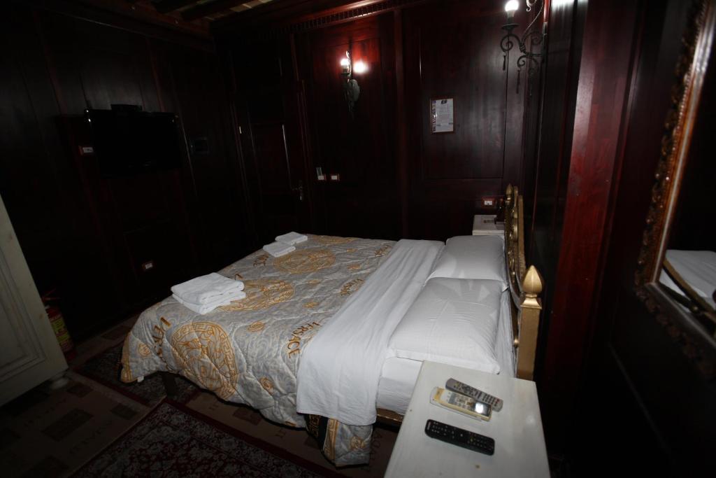 Postel nebo postele na pokoji v ubytování Hotel Iliada