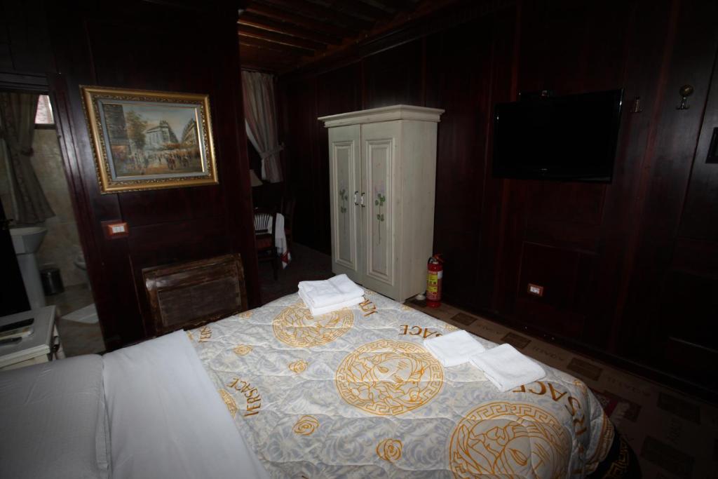 Postel nebo postele na pokoji v ubytování Hotel Iliada