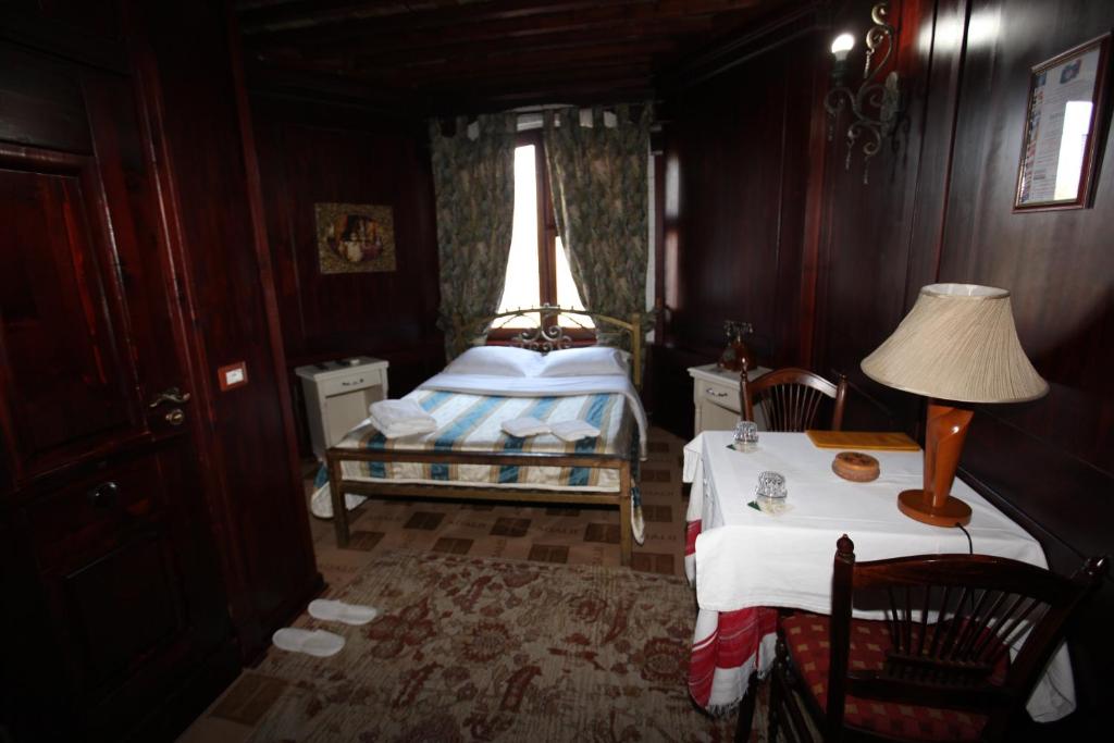 Postel nebo postele na pokoji v ubytování Hotel Iliada