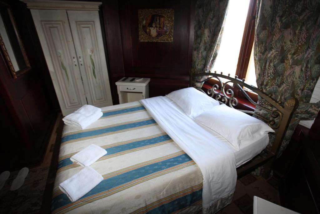 Postel nebo postele na pokoji v ubytování Hotel Iliada