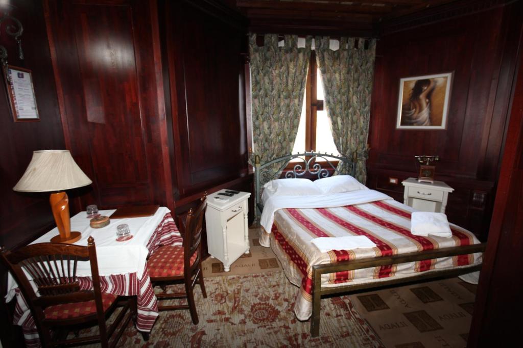 Postel nebo postele na pokoji v ubytování Hotel Iliada