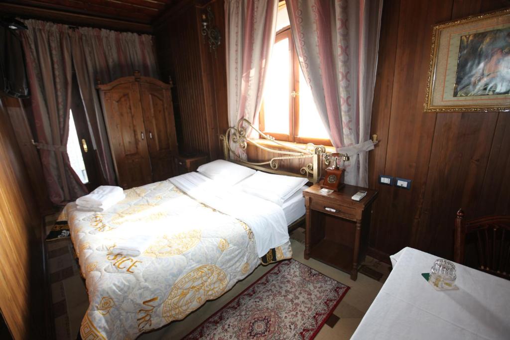 Postel nebo postele na pokoji v ubytování Hotel Iliada