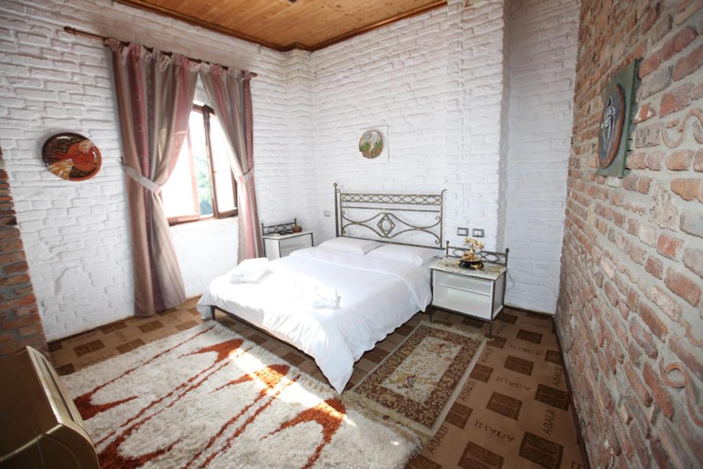 Postel nebo postele na pokoji v ubytování Hotel Iliada