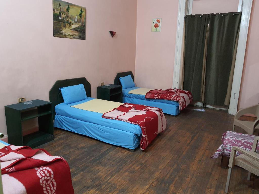 Postel nebo postele na pokoji v ubytování African House Hostel
