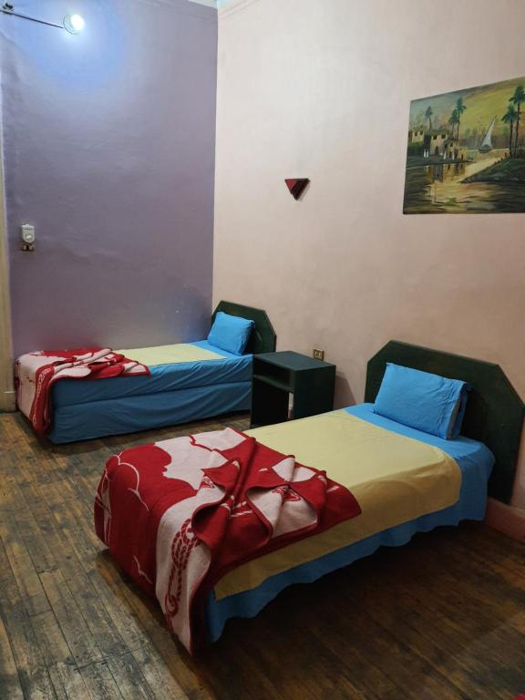 Postel nebo postele na pokoji v ubytování African House Hostel