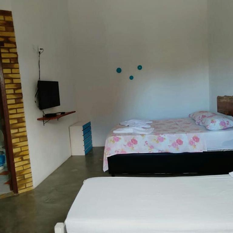 Postel nebo postele na pokoji v ubytování Pousada garça real