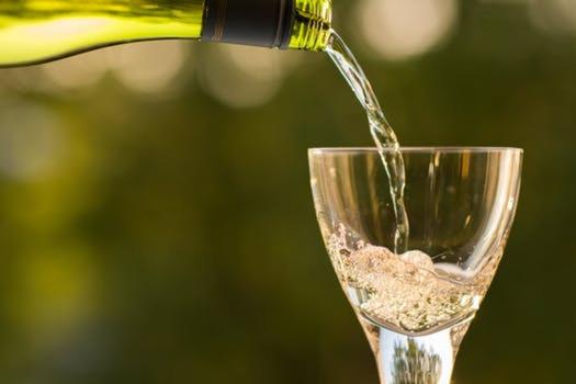 a wine being poured into a wine glass at Guerneville Cottage! Redwoods! Hot Tub! Fire Table! Fast WiFi!! Serenity Defined! in Guerneville