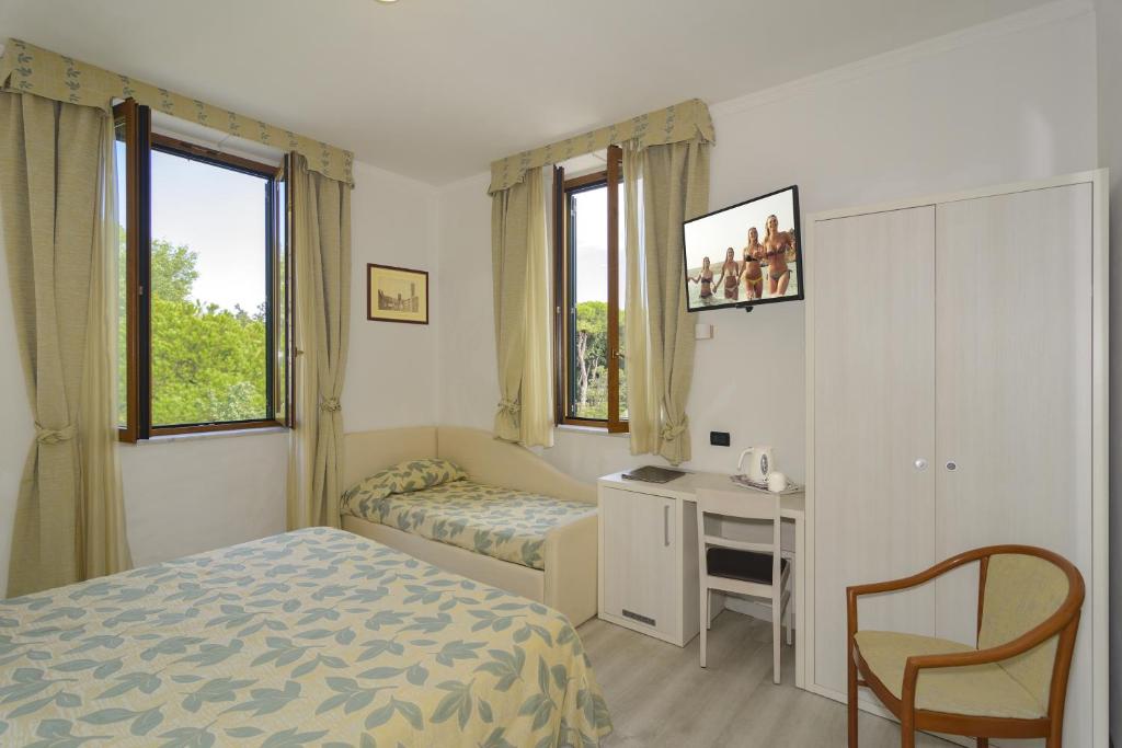 Postel nebo postele na pokoji v ubytování Hotel Vittoria