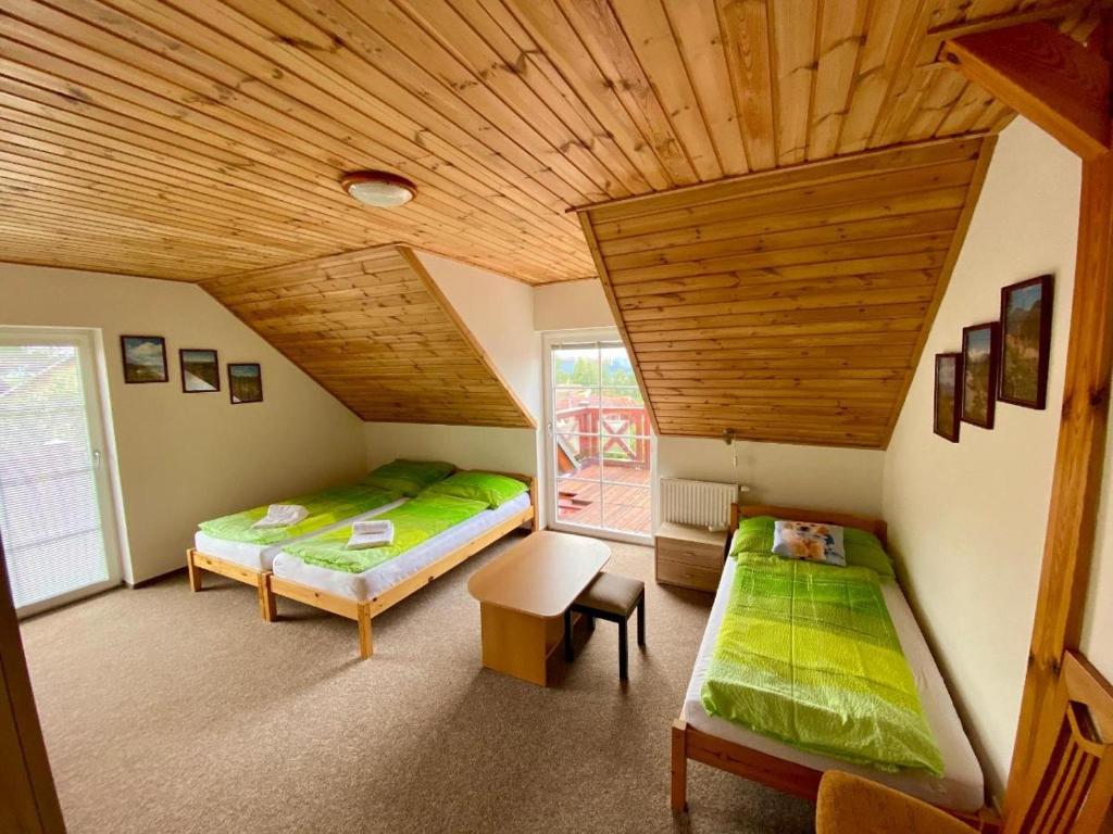 Postel nebo postele na pokoji v ubytování Apartments Lipno Serafin