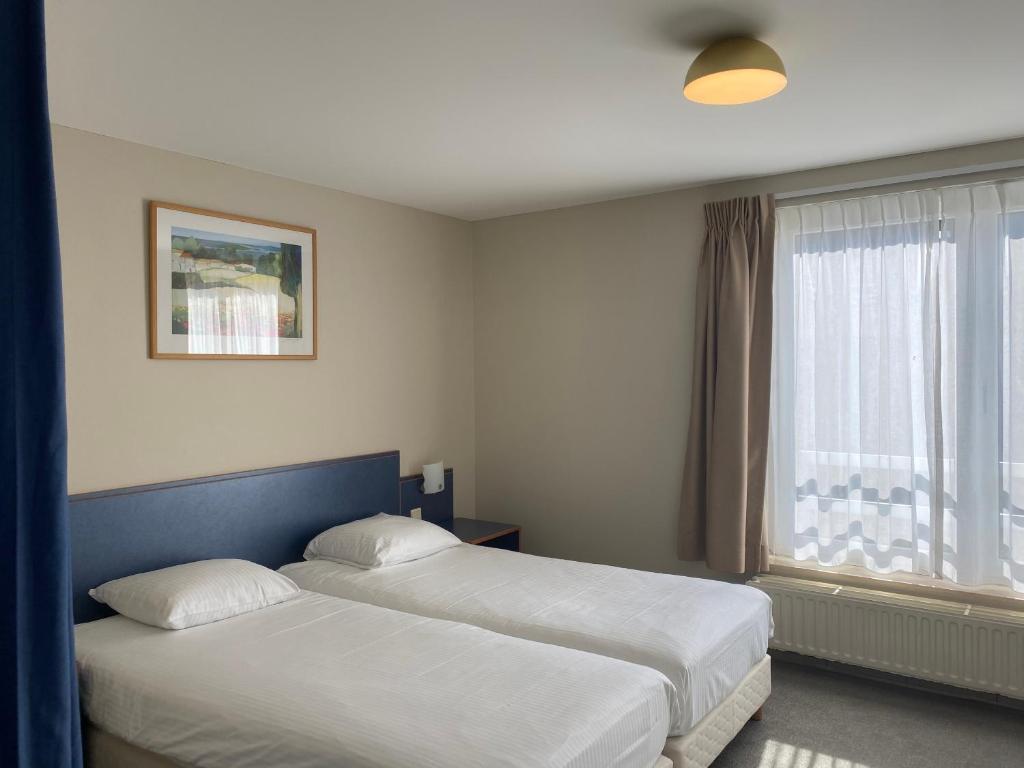 Postel nebo postele na pokoji v ubytování Studio-Hotel Apostroff