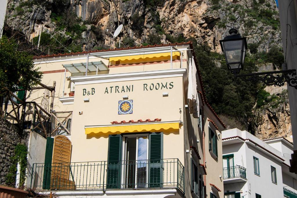 a building with a sign that reads bbb african rooms at Atrani Rooms in Atrani