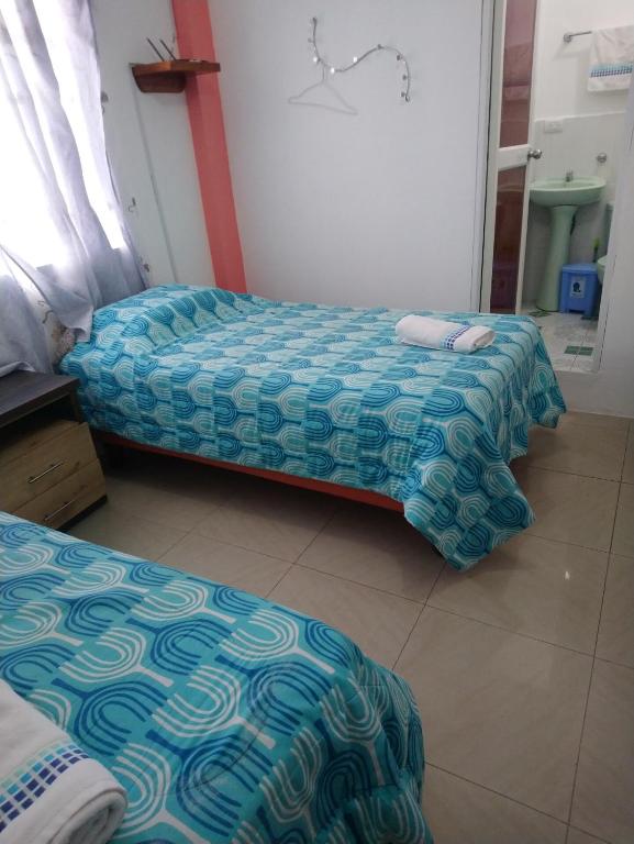Postel nebo postele na pokoji v ubytování Hostal Terito