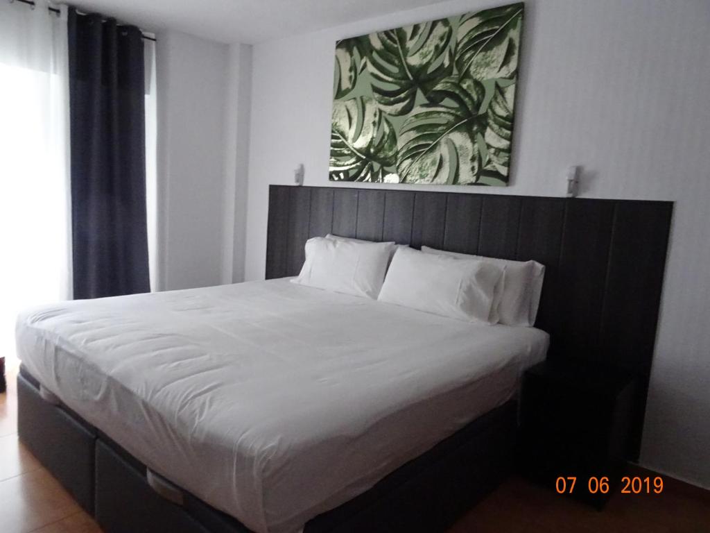 Postel nebo postele na pokoji v ubytování Hotel Carlos III