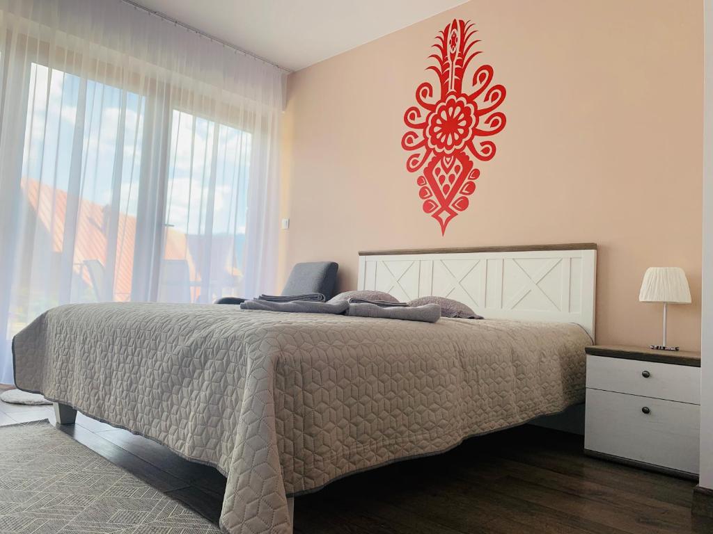 Posteľ alebo postele v izbe v ubytovaní Apartamenty Tomalówka Koscielisko