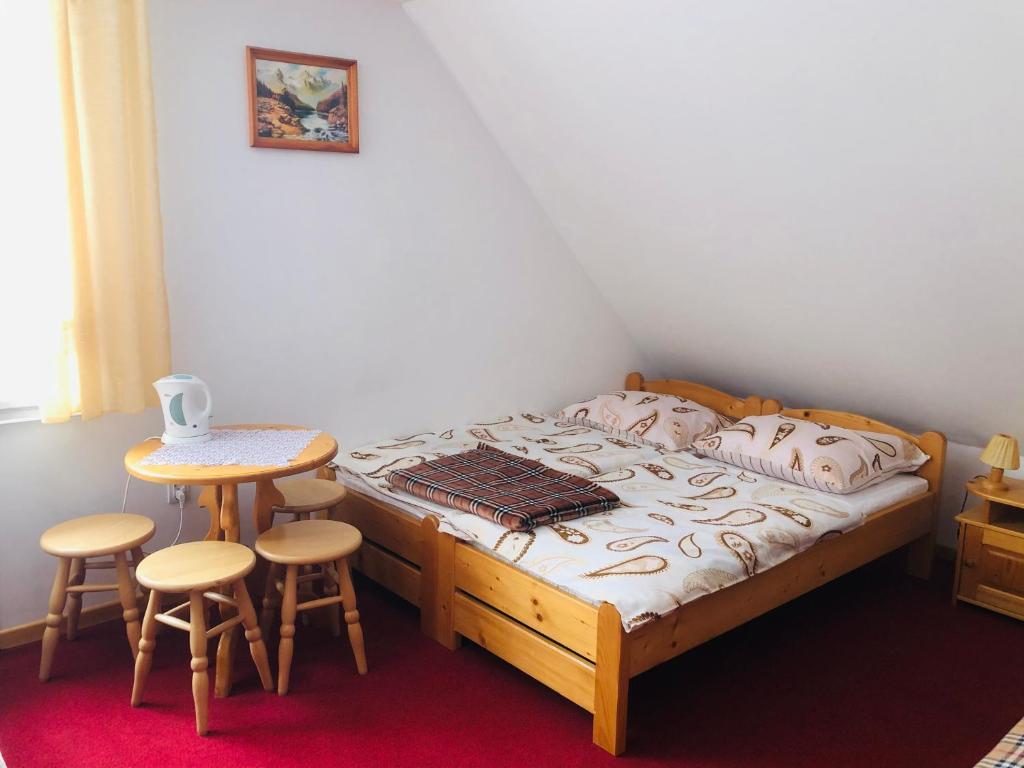 Łóżko lub łóżka w pokoju w obiekcie U Sobali