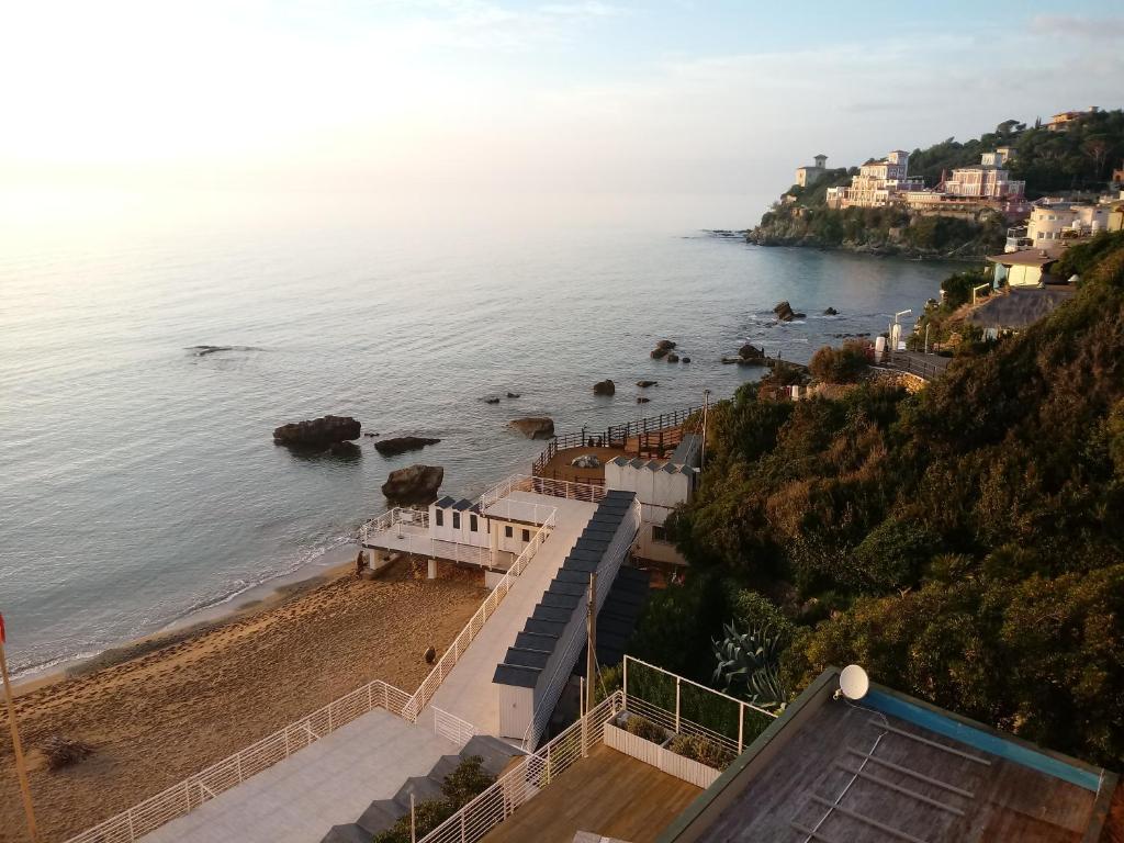 an aerial view of a beach and the ocean at Caletta Beach in Castiglioncello