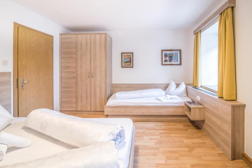 Postel nebo postele na pokoji v ubytování Apartments Heidenberger Fienili