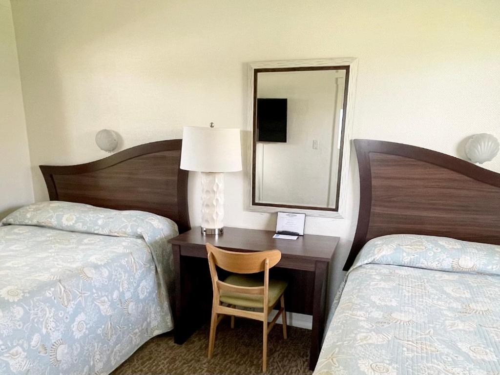 Postel nebo postele na pokoji v ubytování Surf Studio Beach Resort