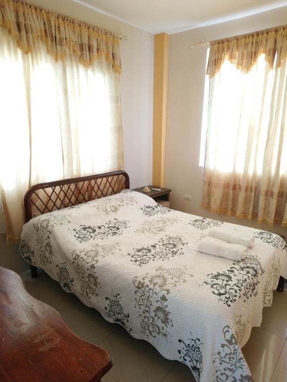 Postel nebo postele na pokoji v ubytování Hostal Terito