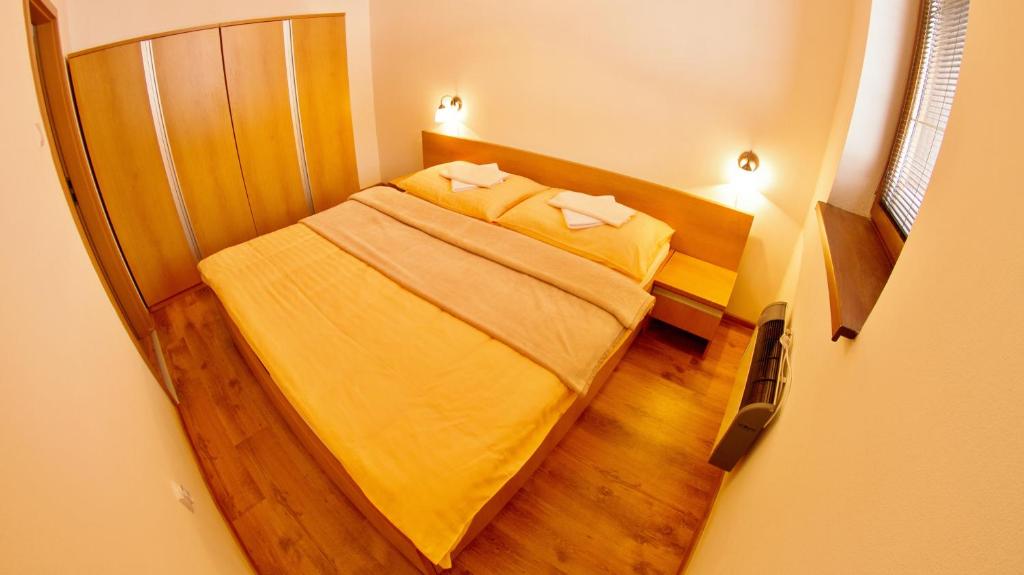 Postel nebo postele na pokoji v ubytování Holiday Resort Telgárt