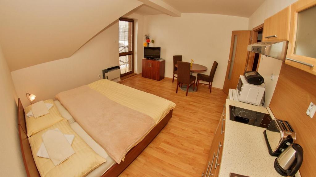 Postel nebo postele na pokoji v ubytování Holiday Resort Telgárt