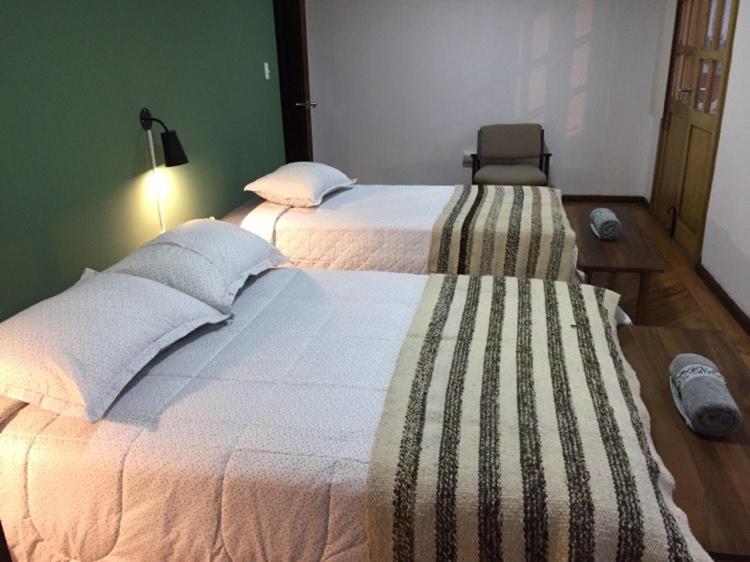 Postel nebo postele na pokoji v ubytování Ñañas Hostel