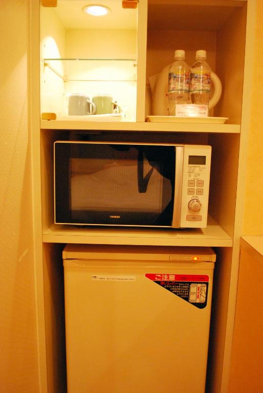 Kuchyň nebo kuchyňský kout v ubytování Ena Hotel Venus