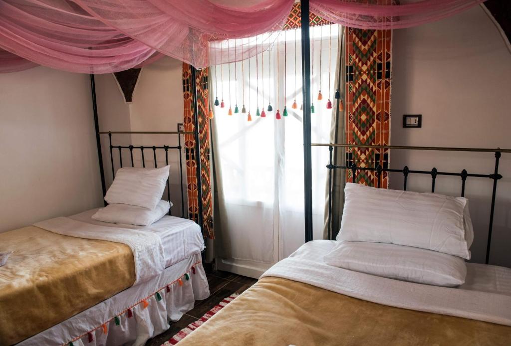 Llit o llits en una habitació de Old Nubian guest house