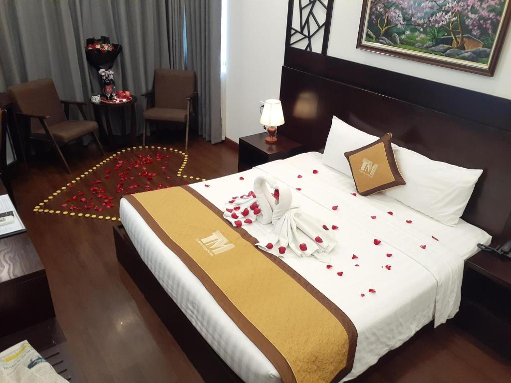 Postel nebo postele na pokoji v ubytování T&M Luxury Hotel Hanoi