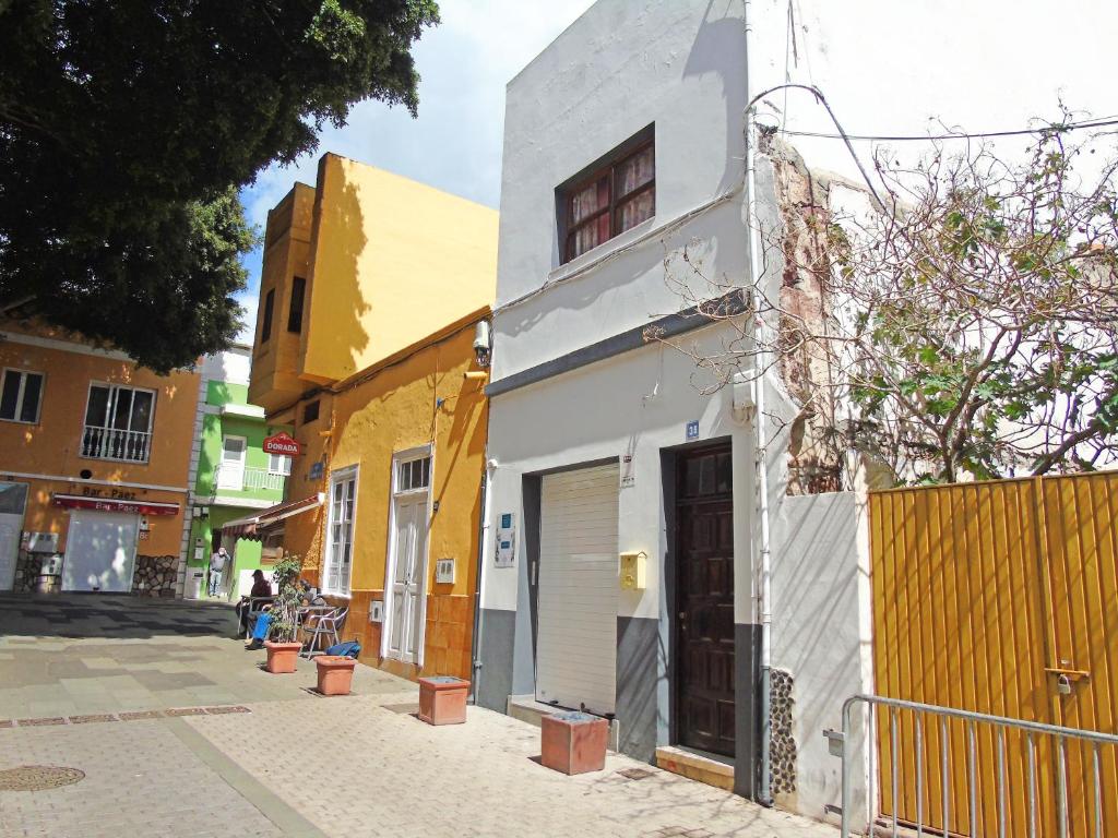 a white building on the side of a street at Fleitas Penthouse with terrace in San Andrés