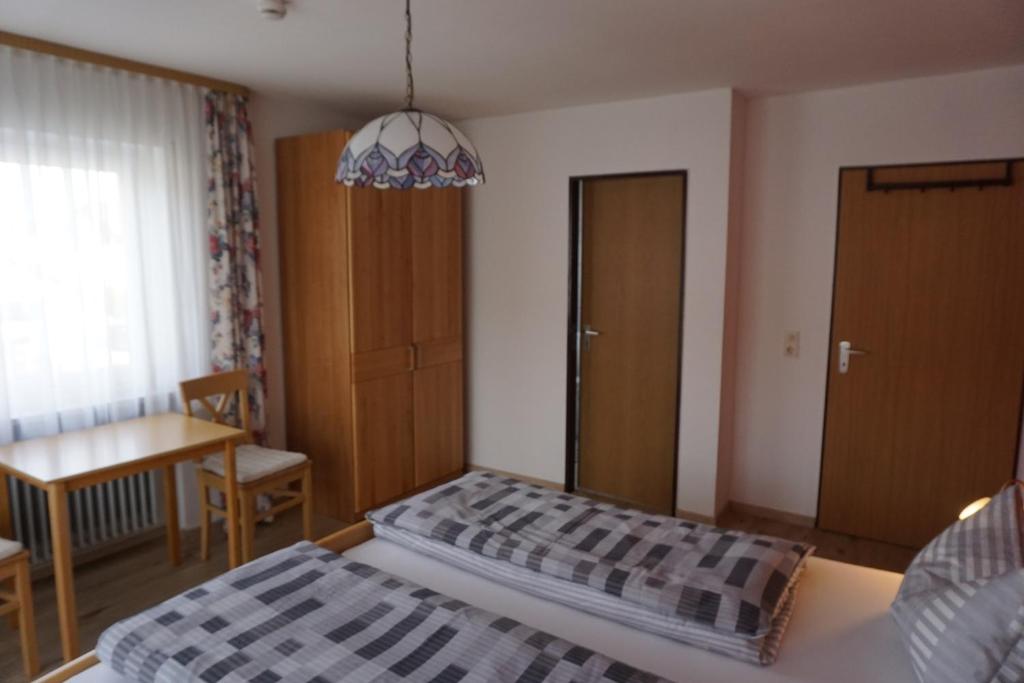 Postel nebo postele na pokoji v ubytování Pension Sonnenhof