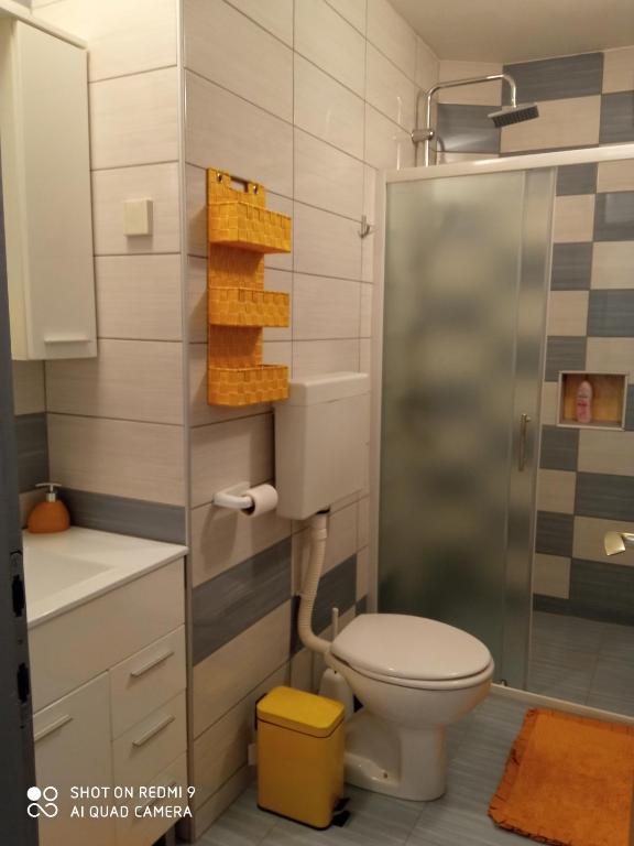 a bathroom with a toilet and a shower at KATY&MLADEN in Baška