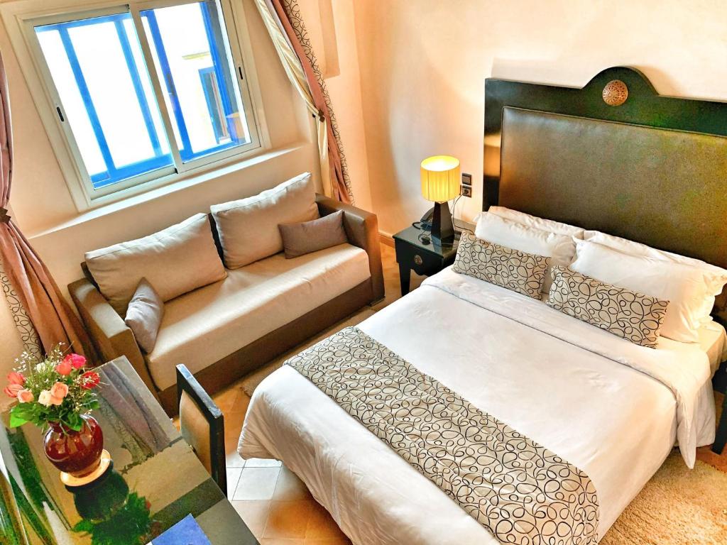 Postel nebo postele na pokoji v ubytování Riad Al Madina